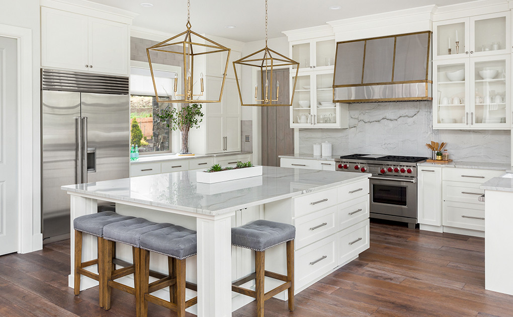 Modern kitchen in white with gold accents